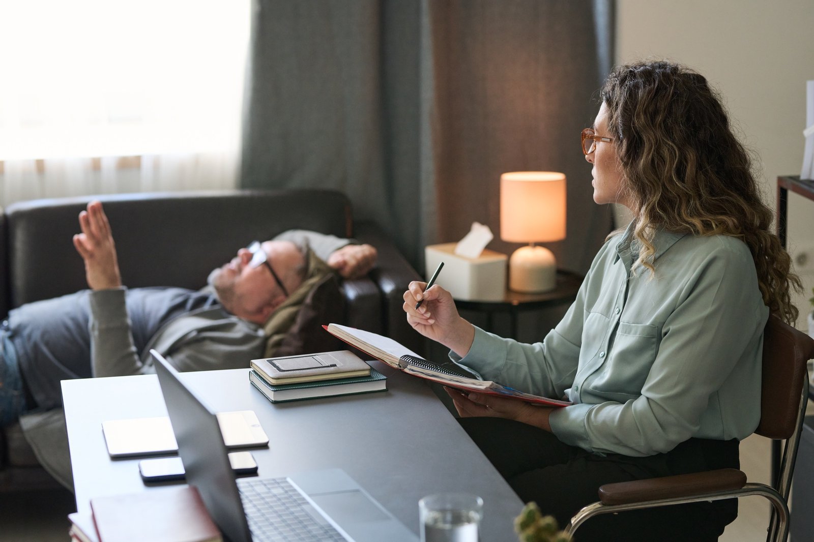 Discussing Psychological Health With Therapist in Office