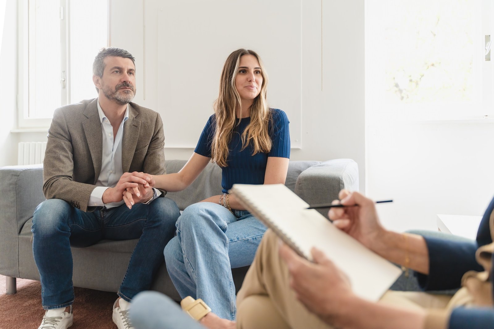 Focused Young Couple in Therapy: Emotions and Insights Captured Focused Young Couple in Therapy: Emotions and Insights Captured